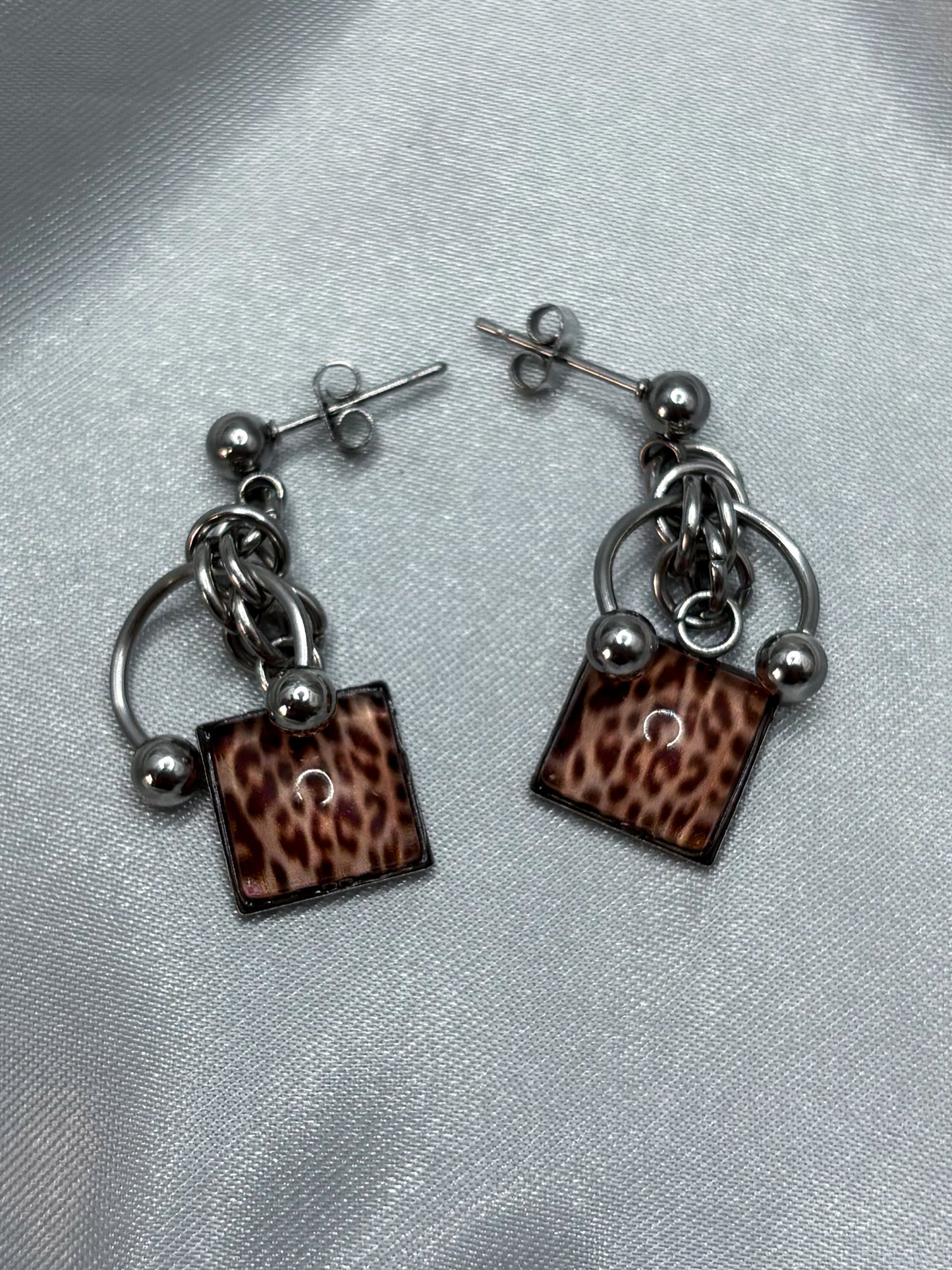 PIERCED LEOPARD EARRINGS