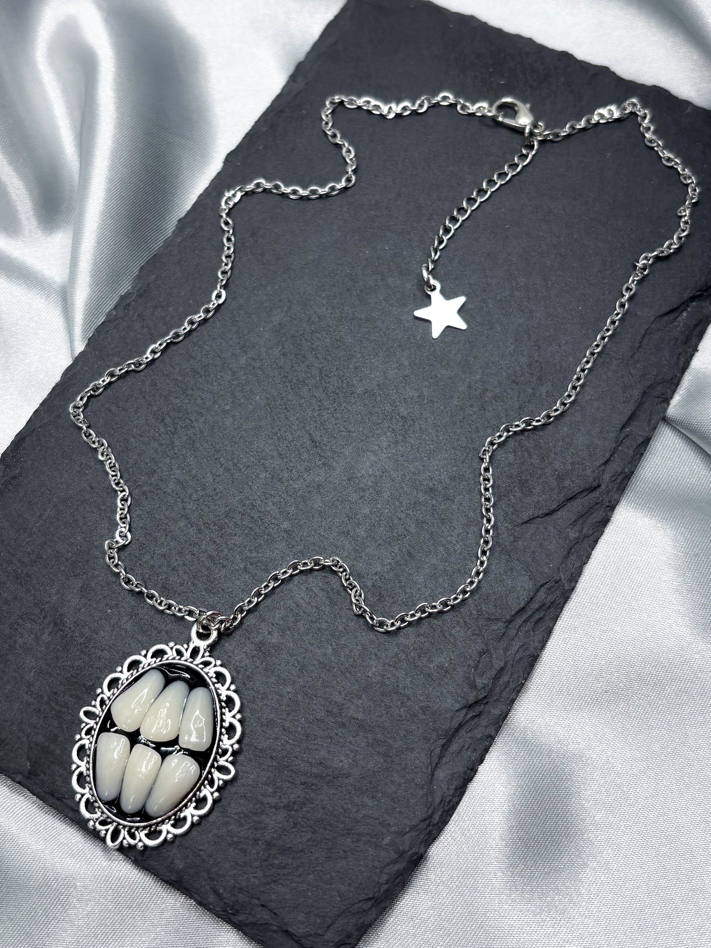 GRINDING TEETH NECKLACE