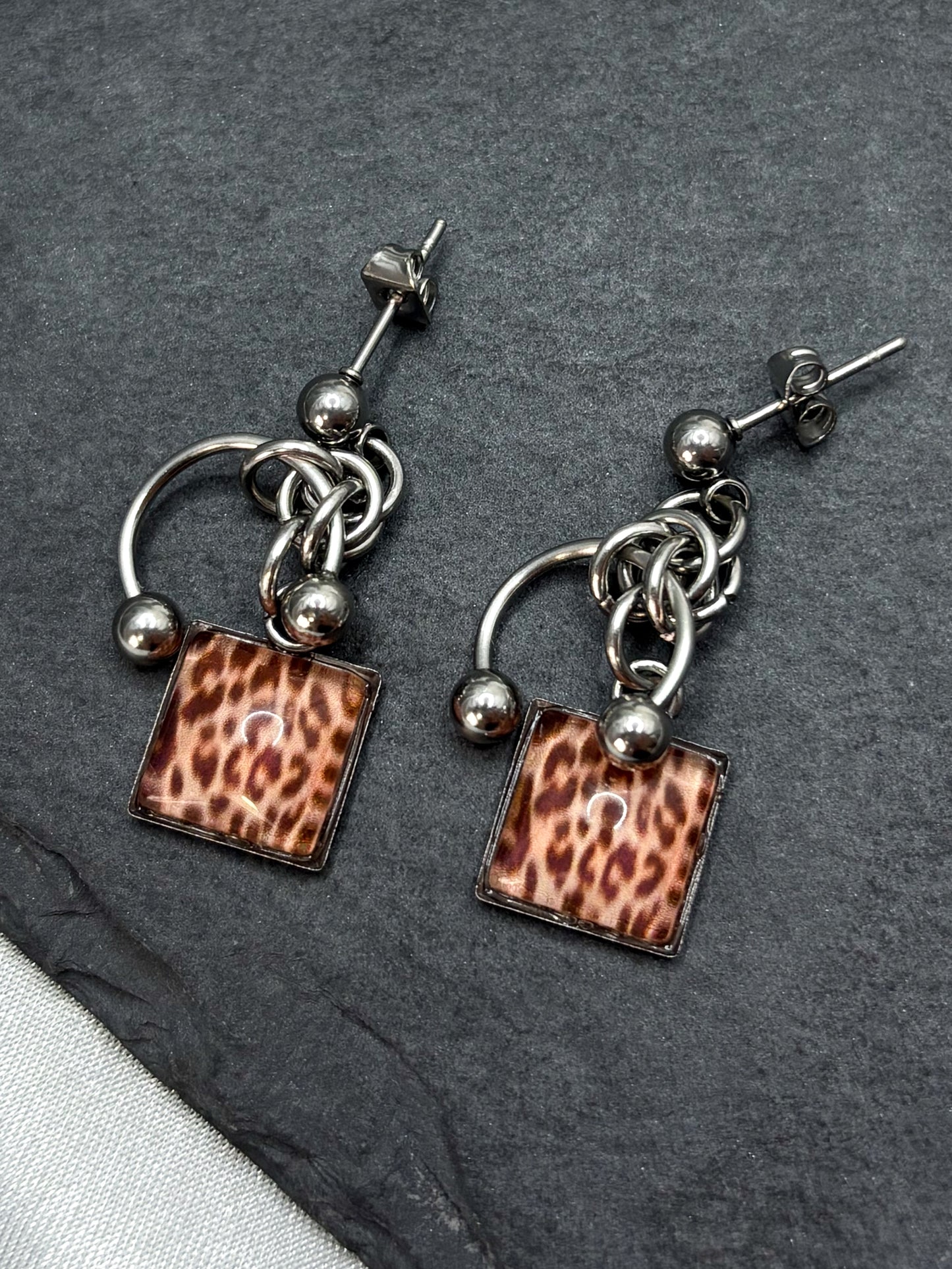 PIERCED LEOPARD EARRINGS