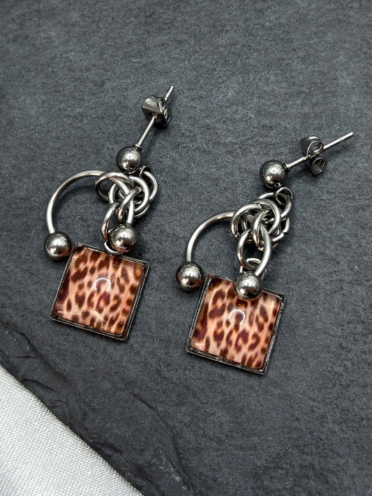 PIERCED LEOPARD EARRINGS