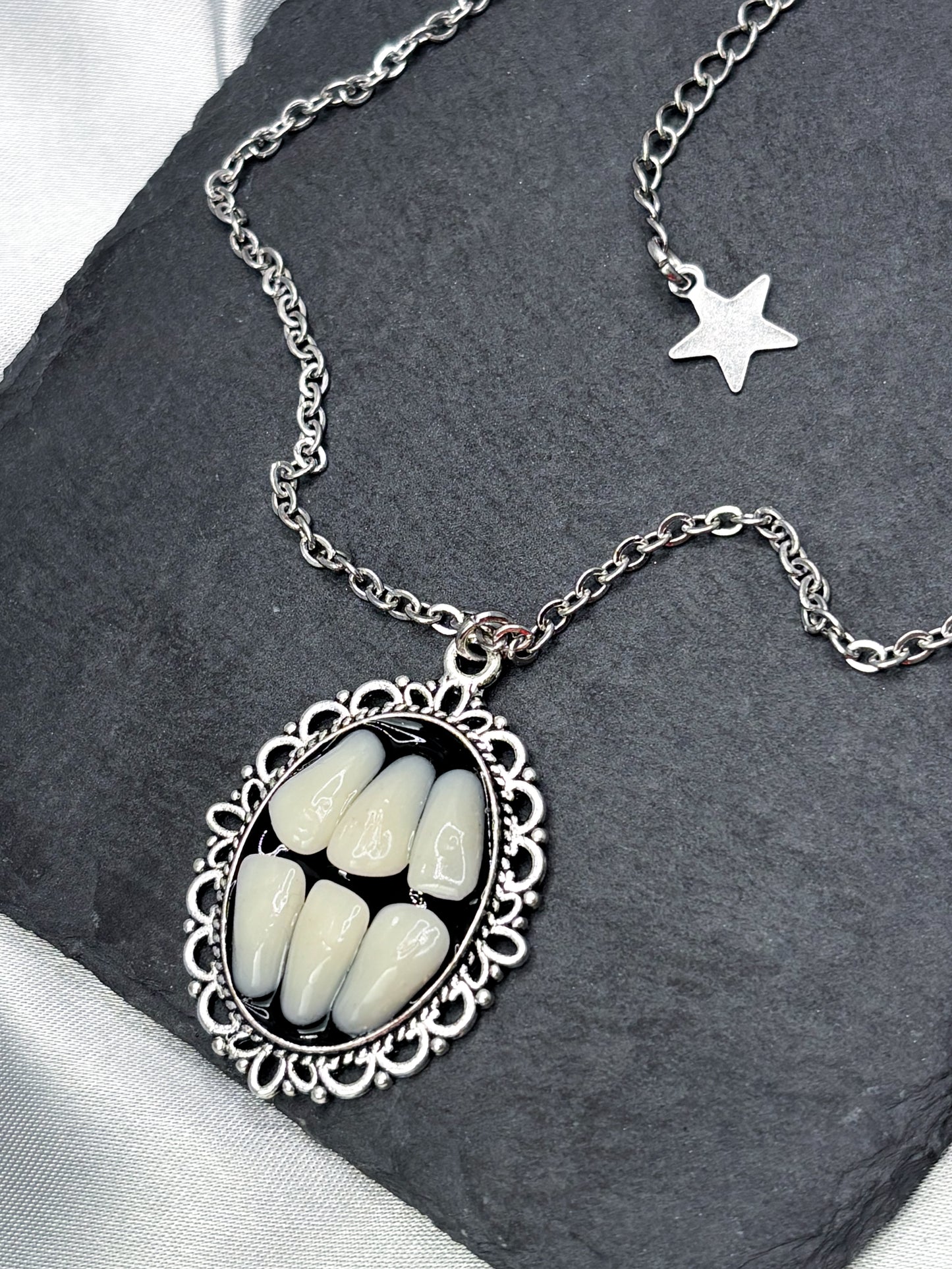 GRINDING TEETH NECKLACE