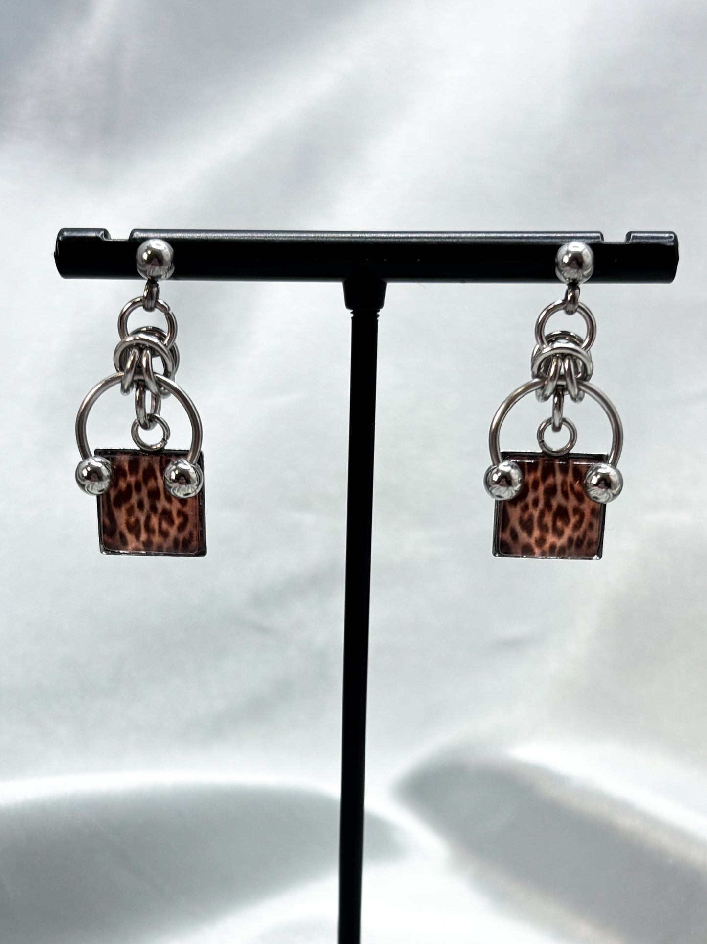 PIERCED LEOPARD EARRINGS