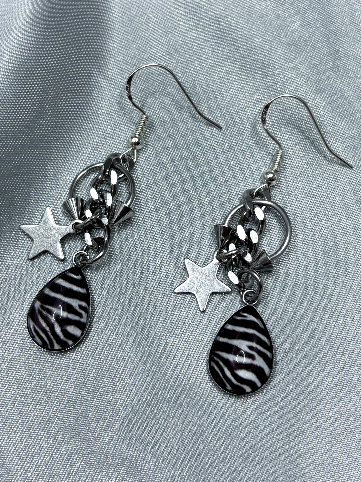 PIERCED ZEBRA EARRINGS