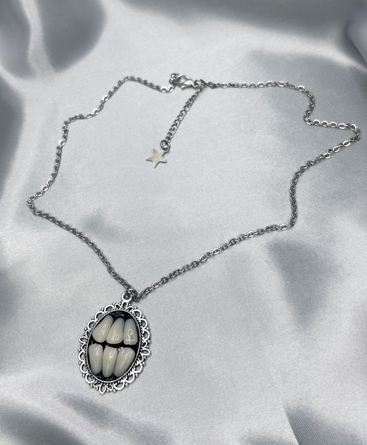 GRINDING TEETH NECKLACE