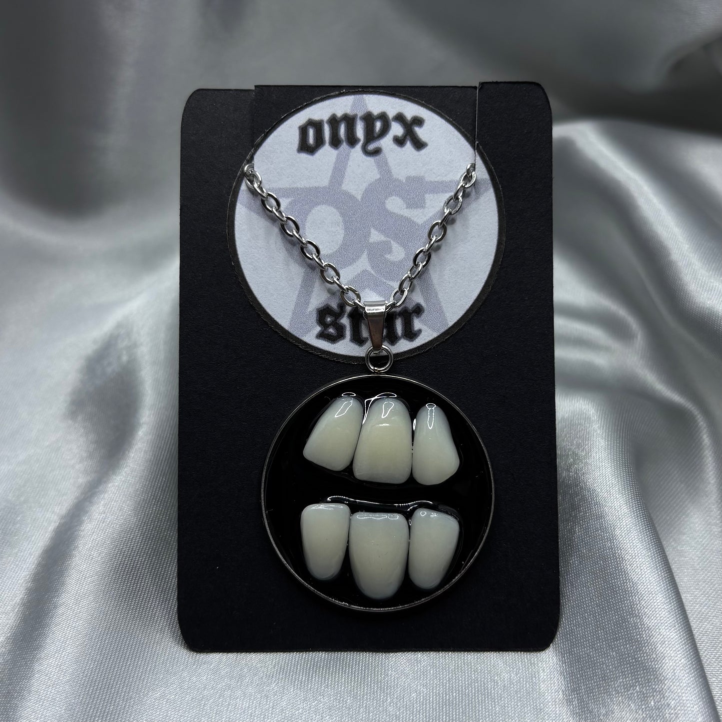 GRINDING TEETH NECKLACE