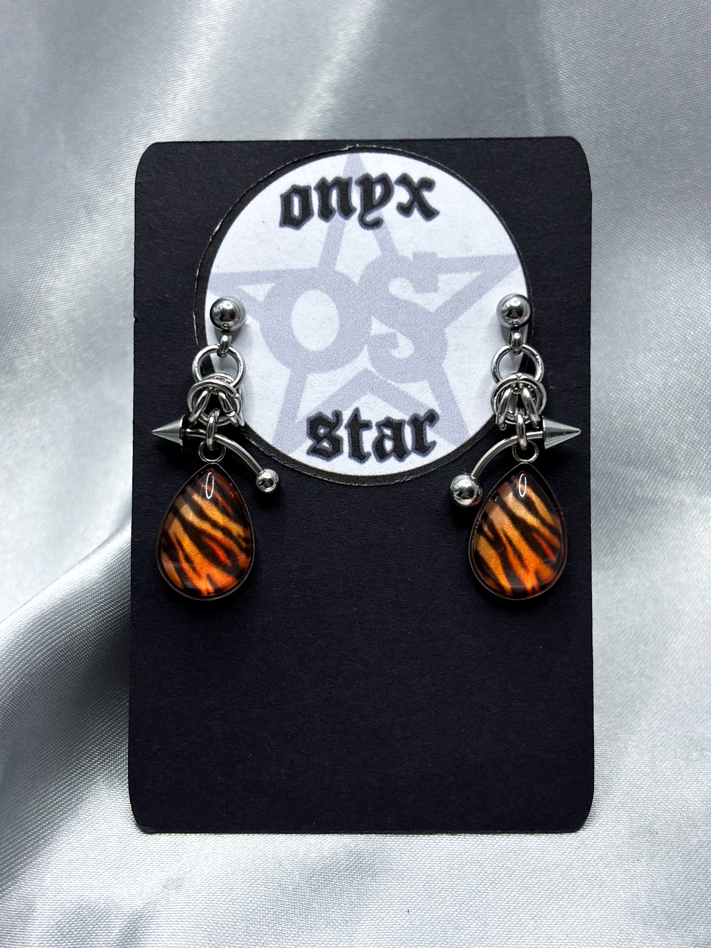 PIERCED OVAL TIGER EARRINGS