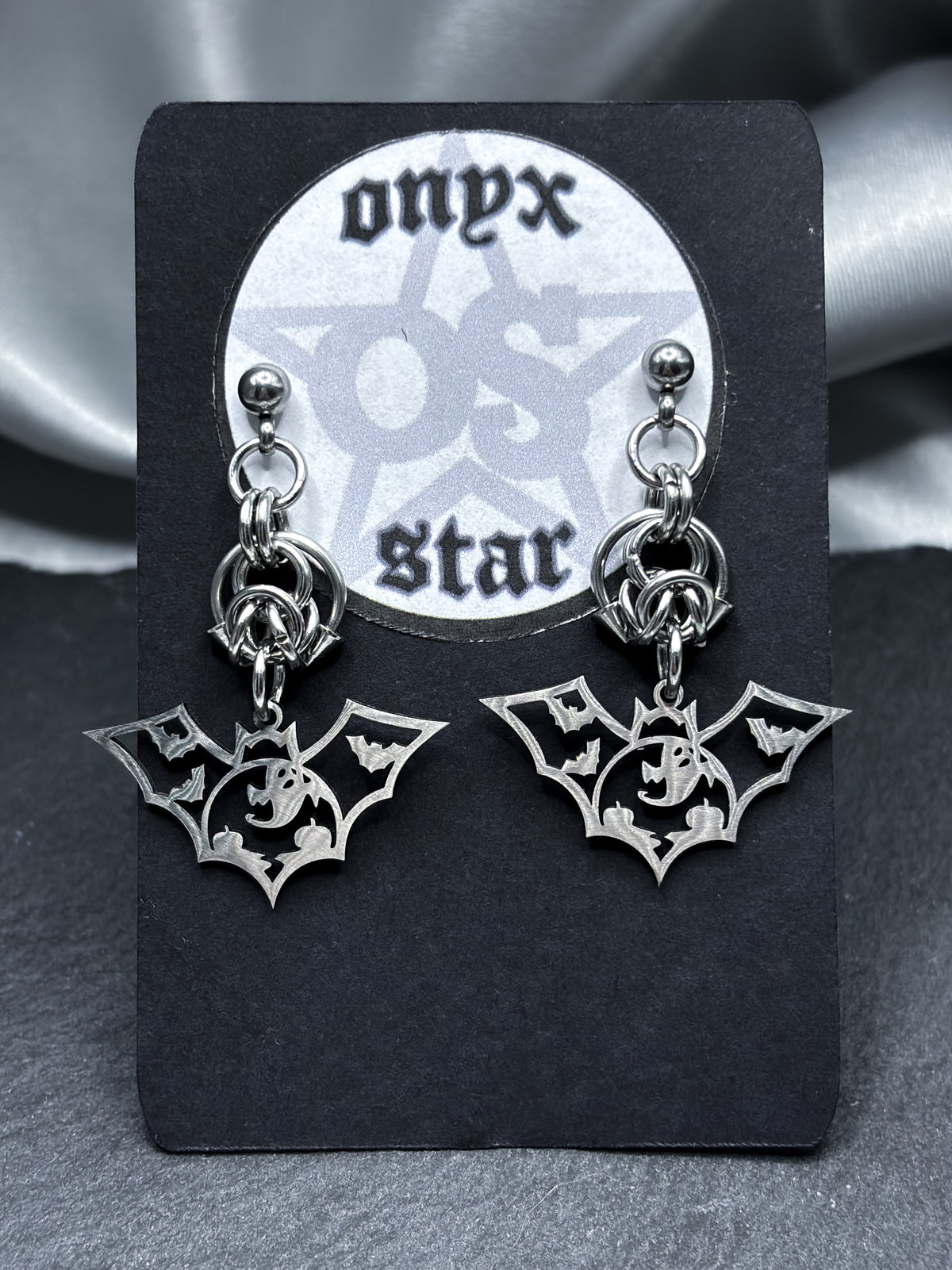 HOLLOW BAT EARRINGS