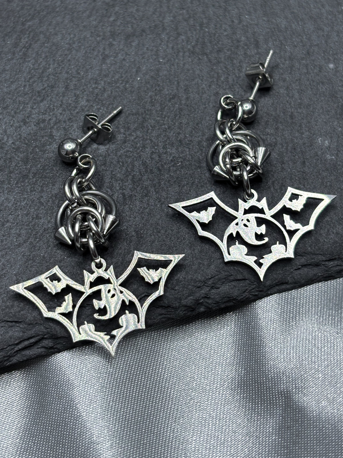 HOLLOW BAT EARRINGS