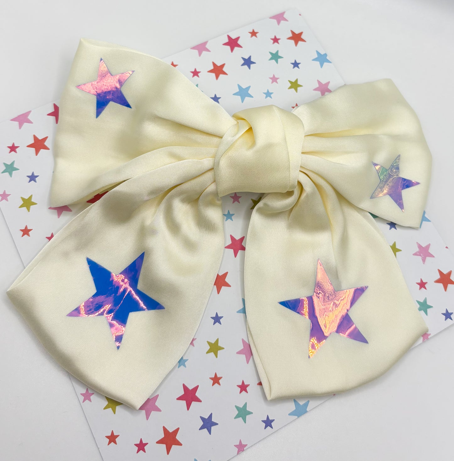 Ivory Bow with Iridescent Stars