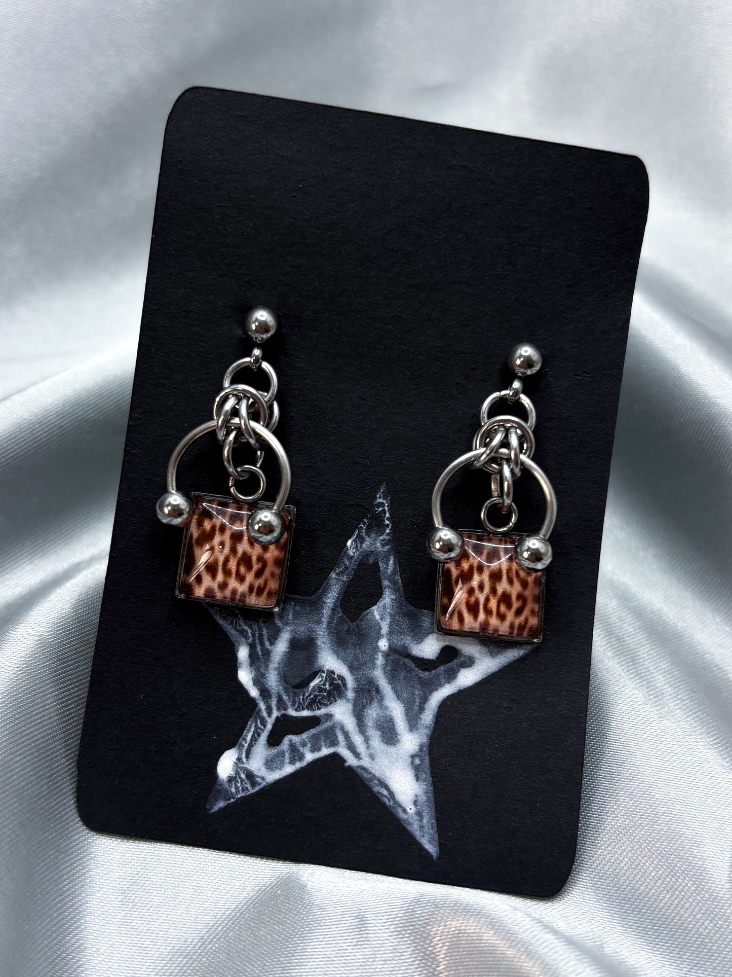PIERCED LEOPARD EARRINGS