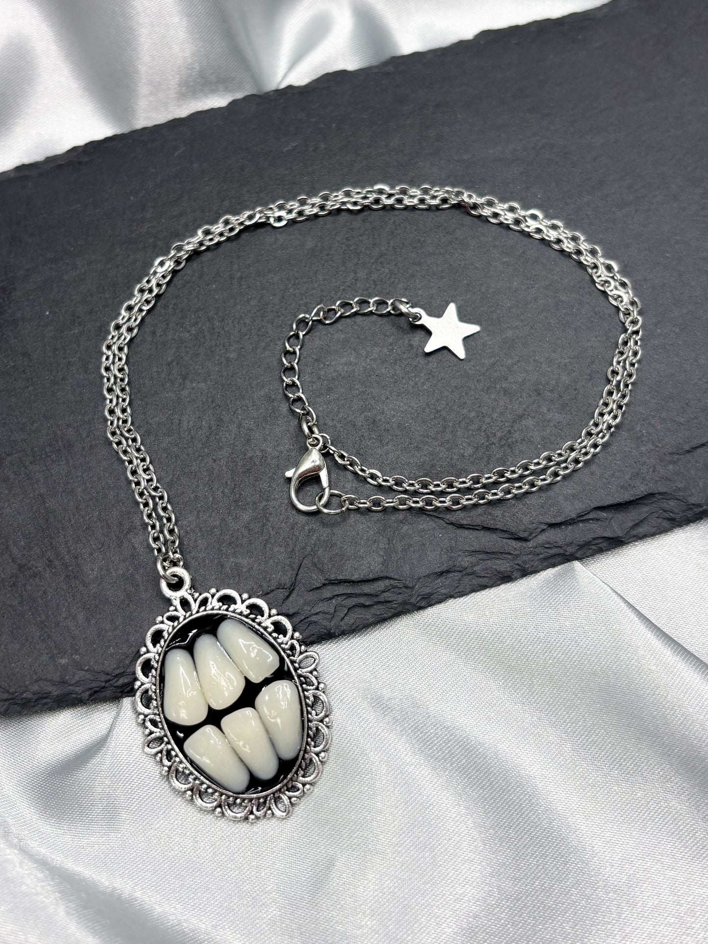 GRINDING TEETH NECKLACE