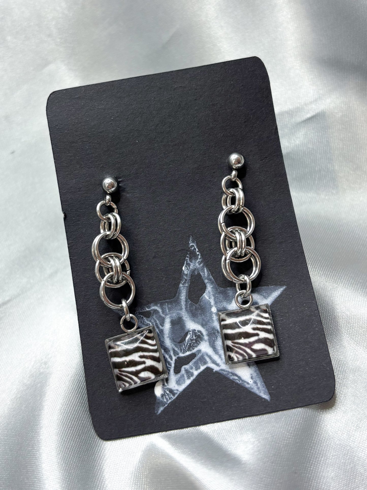 CHAINED ZEBRA EARRINGS