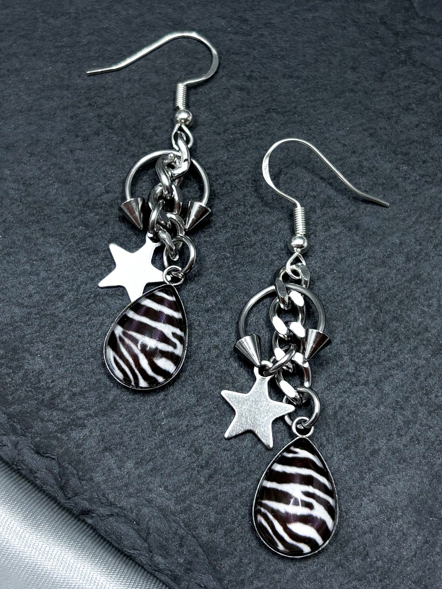 PIERCED ZEBRA EARRINGS