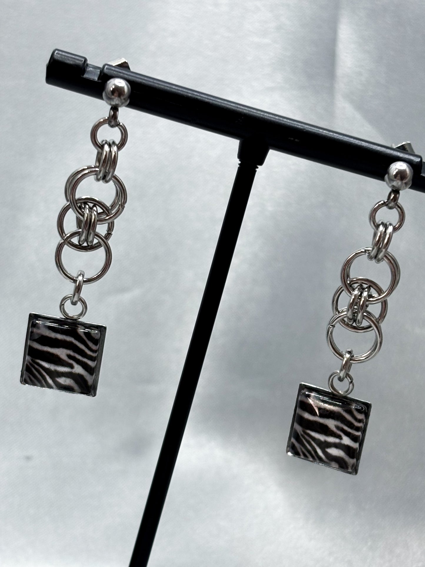 CHAINED ZEBRA EARRINGS